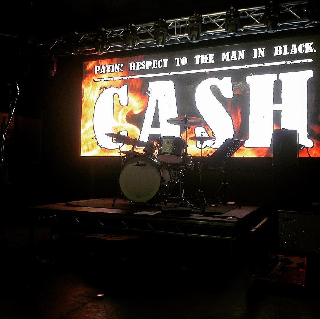 CASH (paying respect to the man in black) ©Alex Bridge